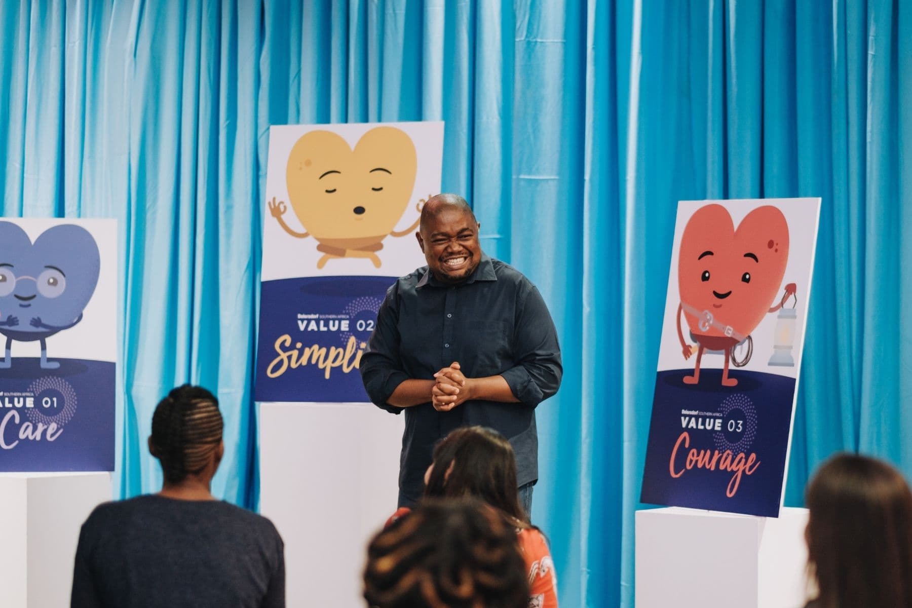 A facilitator presenting Beiersdorf South Africa values during an internal team session.