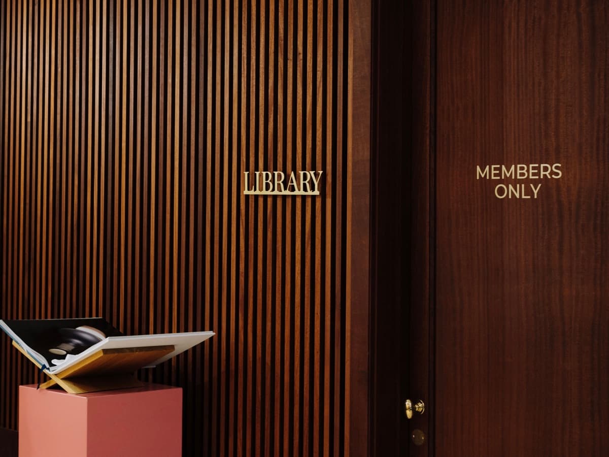 A timber doorway marked Library and Members Only.