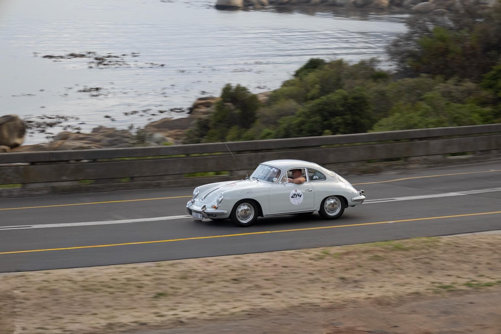 A classic Porsche travelling beside the coast during The Cape 1000.