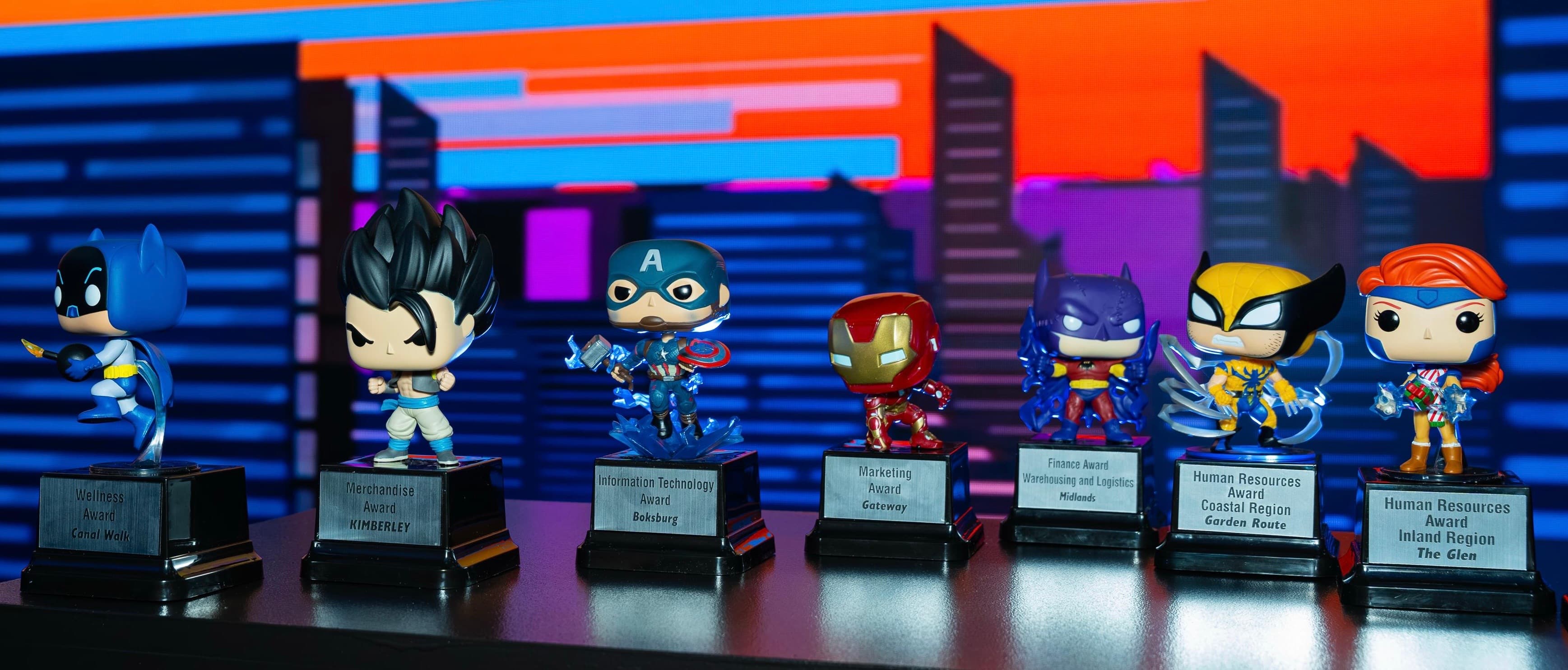 Superhero trophies displayed at the Toys R Us Roadshow and Awards Dinner.